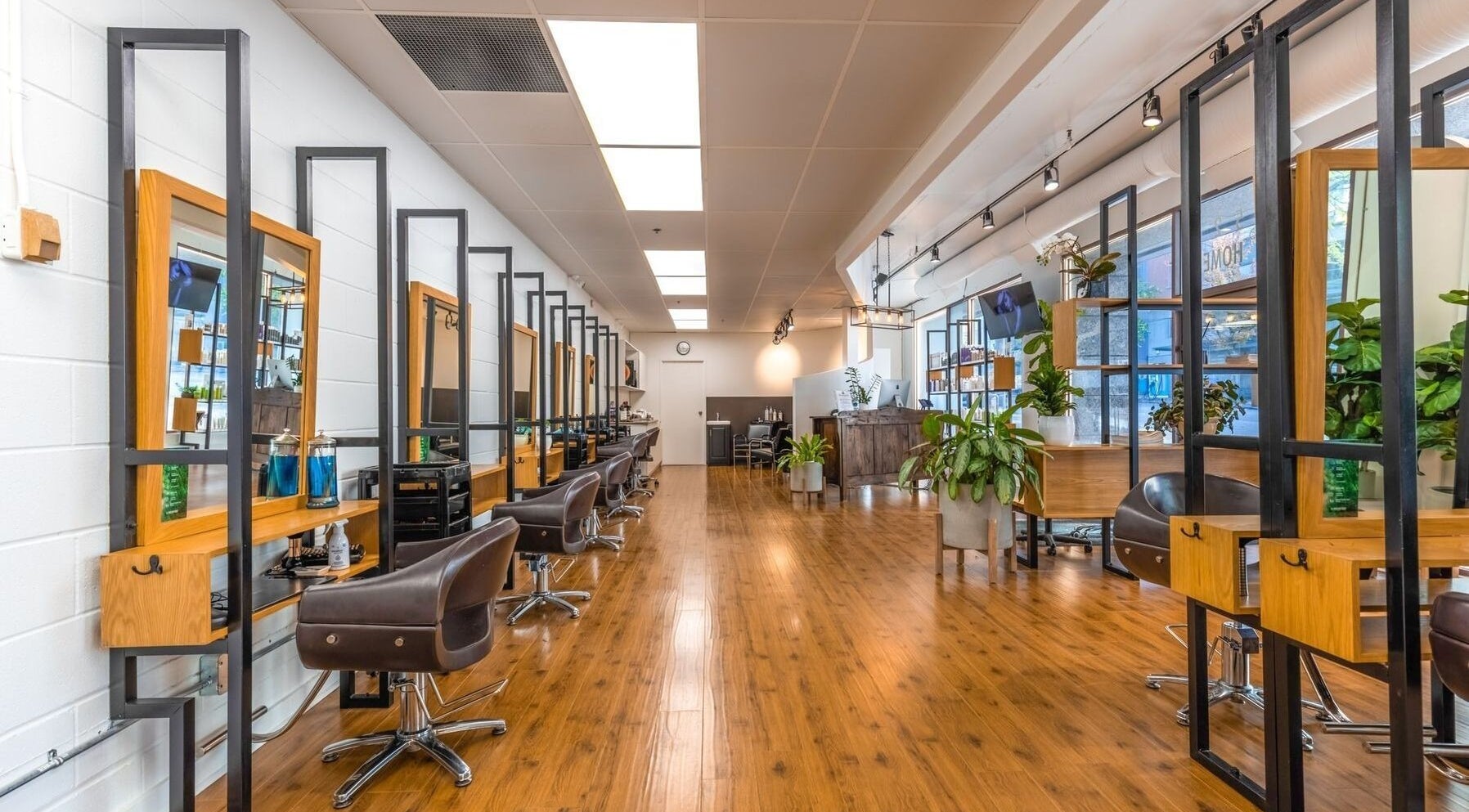 Modern styling chairs and mirrors at OSO Hair Salon, Vancouver, British Columbia, CA.