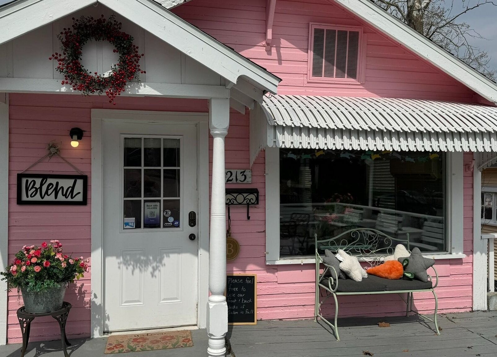 Charming pink facade of Blend, a beauty and wellness venue in Branson, Missouri, US with inviting decor.