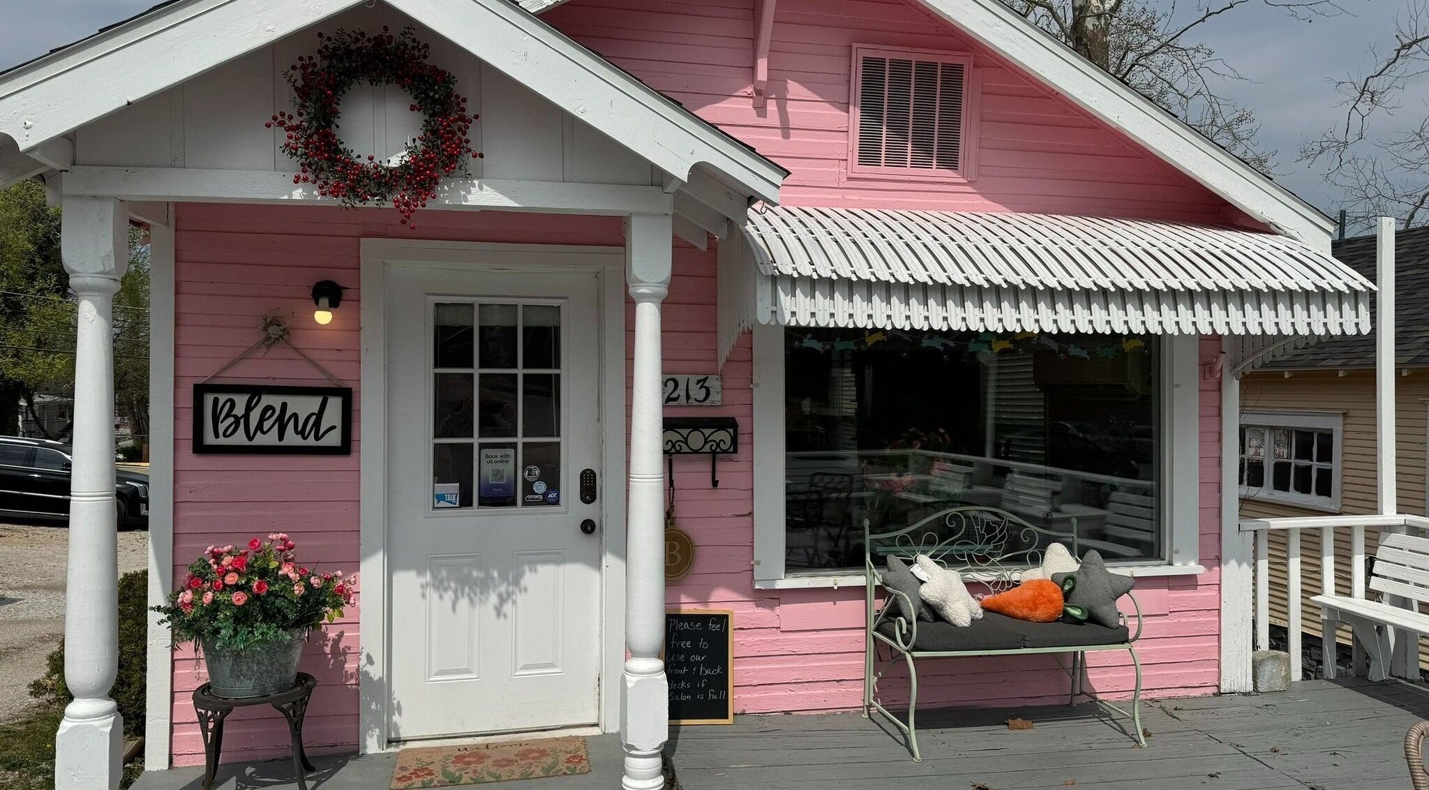 Charming pink facade of Blend, a beauty and wellness venue in Branson, Missouri, US with inviting decor.