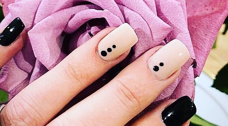 Stylish manicure with black dots at Stephanie’s Studio at Fit24, Durban North, KwaZulu-Natal, ZA.