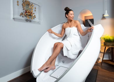 Woman enjoying a relaxing wellness pod at Wellness at The Laslett in London, England, GB.