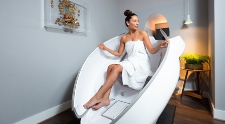 Woman enjoying a relaxing wellness pod at Wellness at The Laslett in London, England, GB.