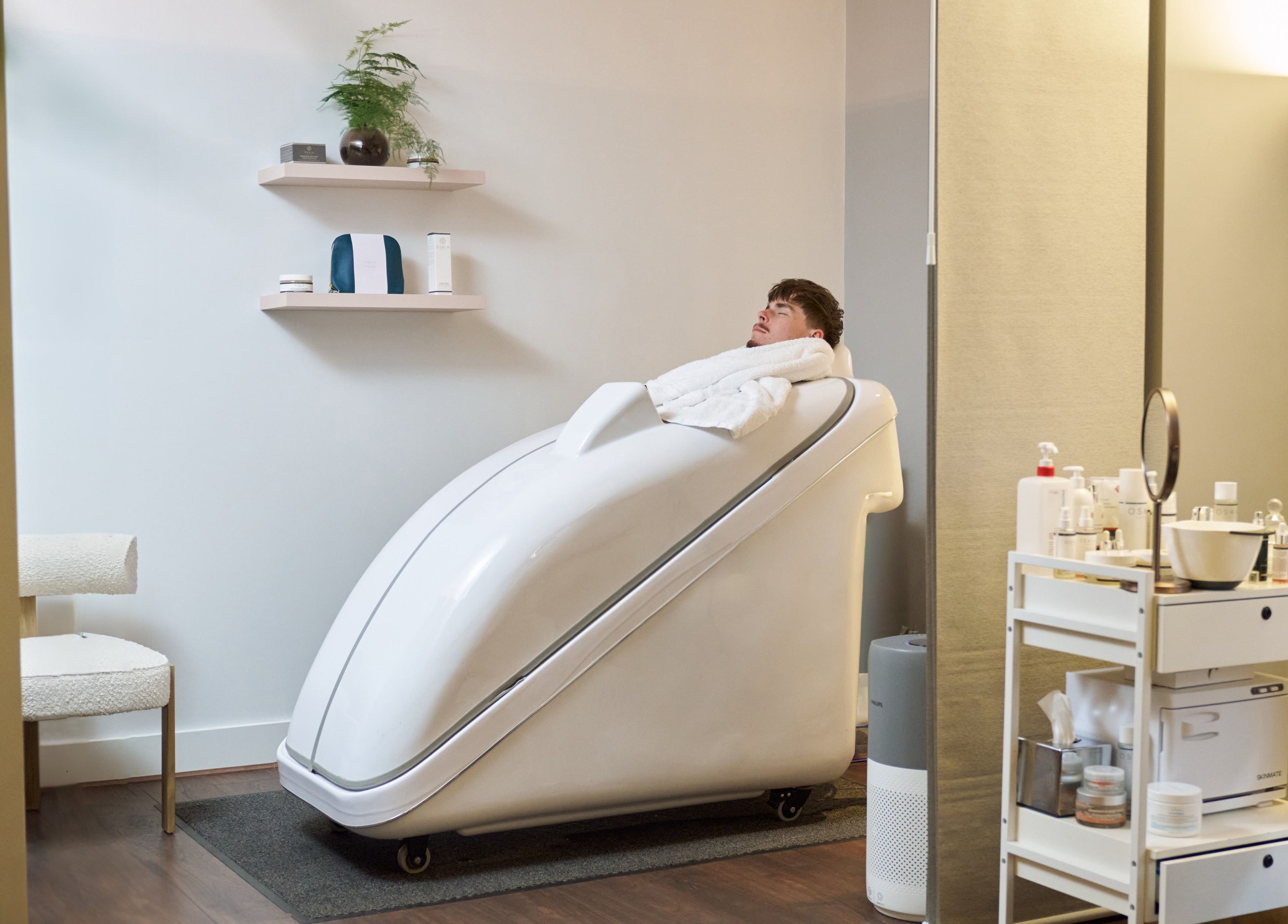 Man relaxing in a sauna pod at Wellness at The Laslett, London, England, GB. Experience serenity and rejuvenation.