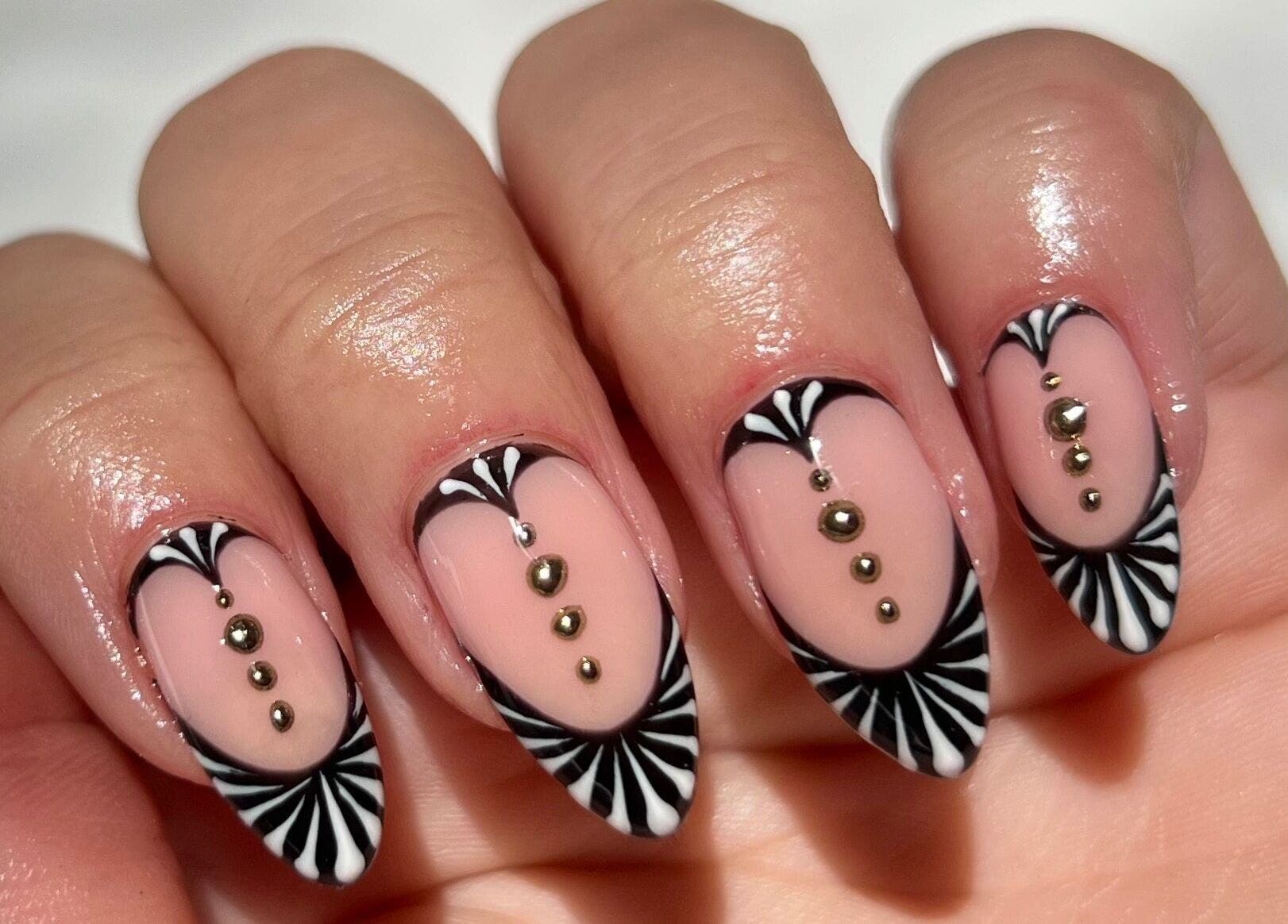 Elegant black and gold nail art by BELÀR esthetics in Disley, England, GB for a unique style statement.