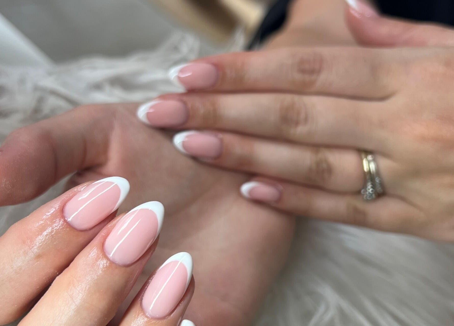 Classic French manicure at BELÀR esthetics, Disley, England, GB, showcasing elegant nail designs.