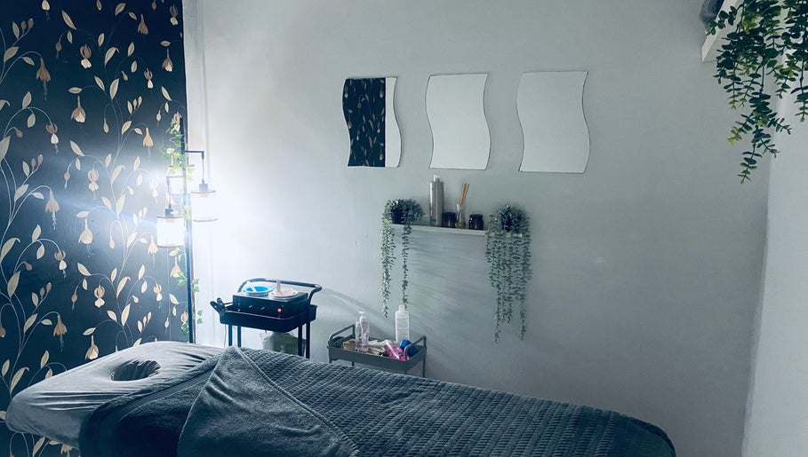 Relaxing massage room at Head to Toe in Grassmoor, England, GB adorned with stylish decor and calming ambiance.