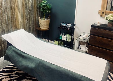 Tranquil treatment room at Head to Toe, Grassmoor, England, GB, featuring massage table and calming decor.