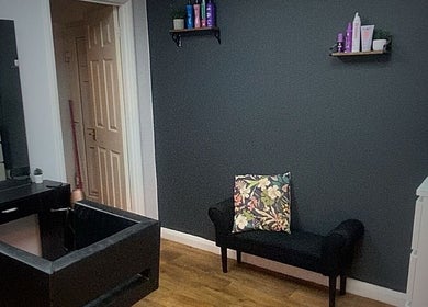 Elegant beauty corner at Head to Toe, Grassmoor, England featuring a stylish black wash basin and modern decor.