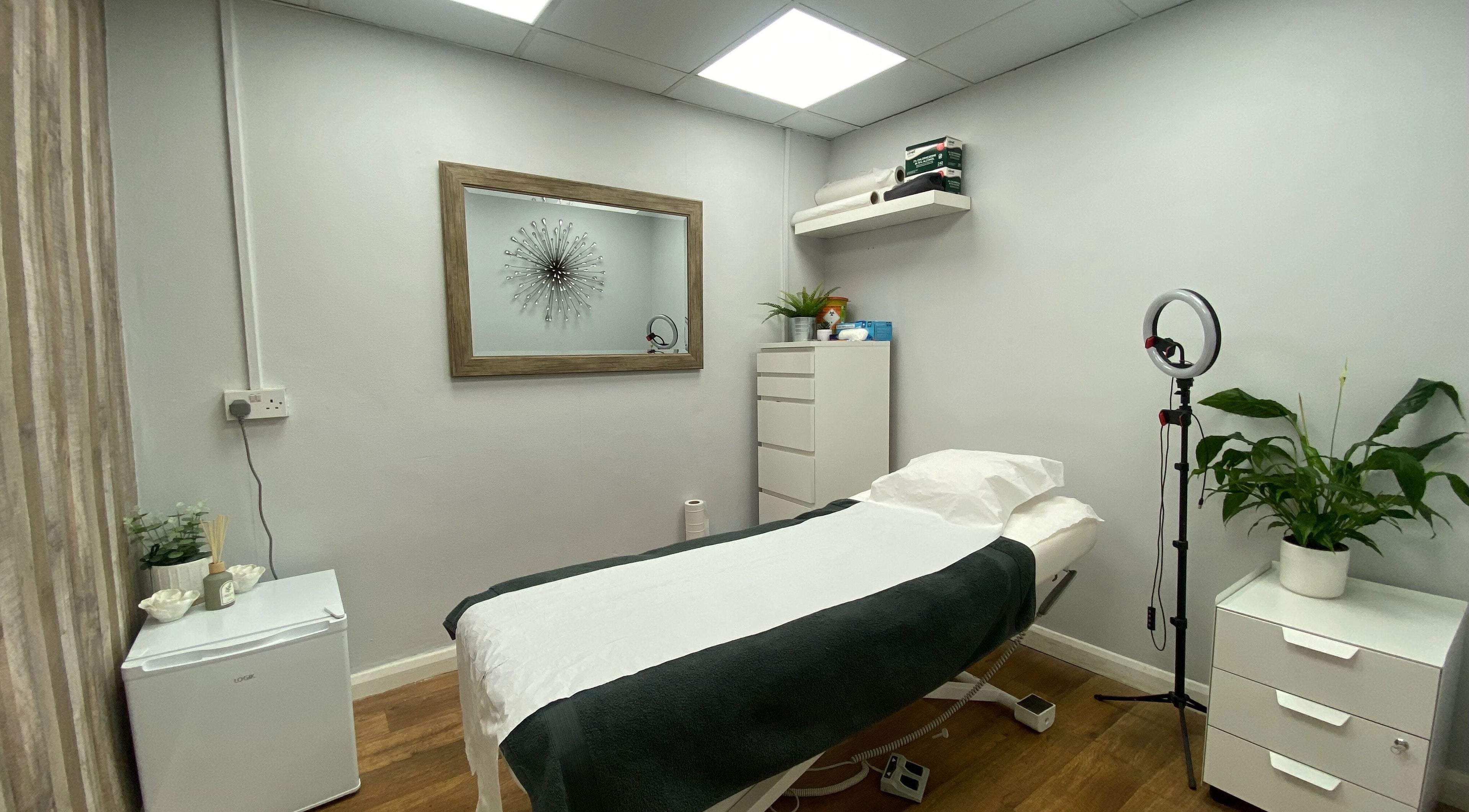 Calm treatment room at Head to Toe in Grassmoor, England, GB with bed, decor, and lighting.