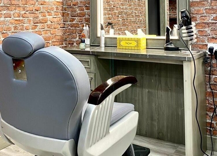 Barber chair at Vintage Men's SPA, Al Wahada Mall, Abu Dhabi, offers a rustic grooming experience.