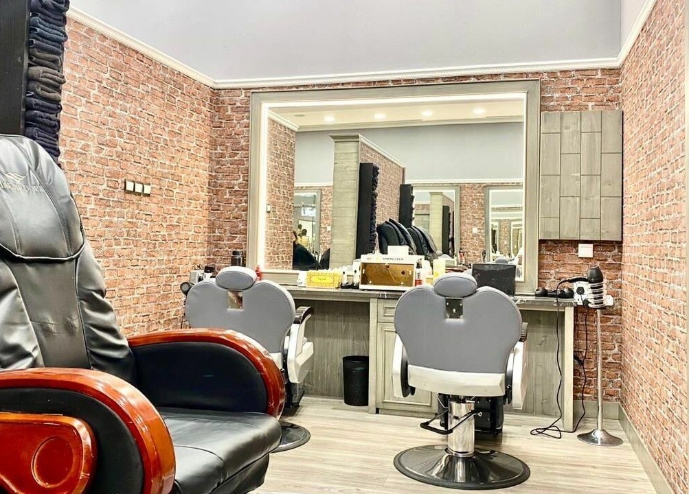 Vintage Men's SPA at Al Wahada Mall in Abu Dhabi, AE showcases luxurious barber chairs and rustic brick walls.