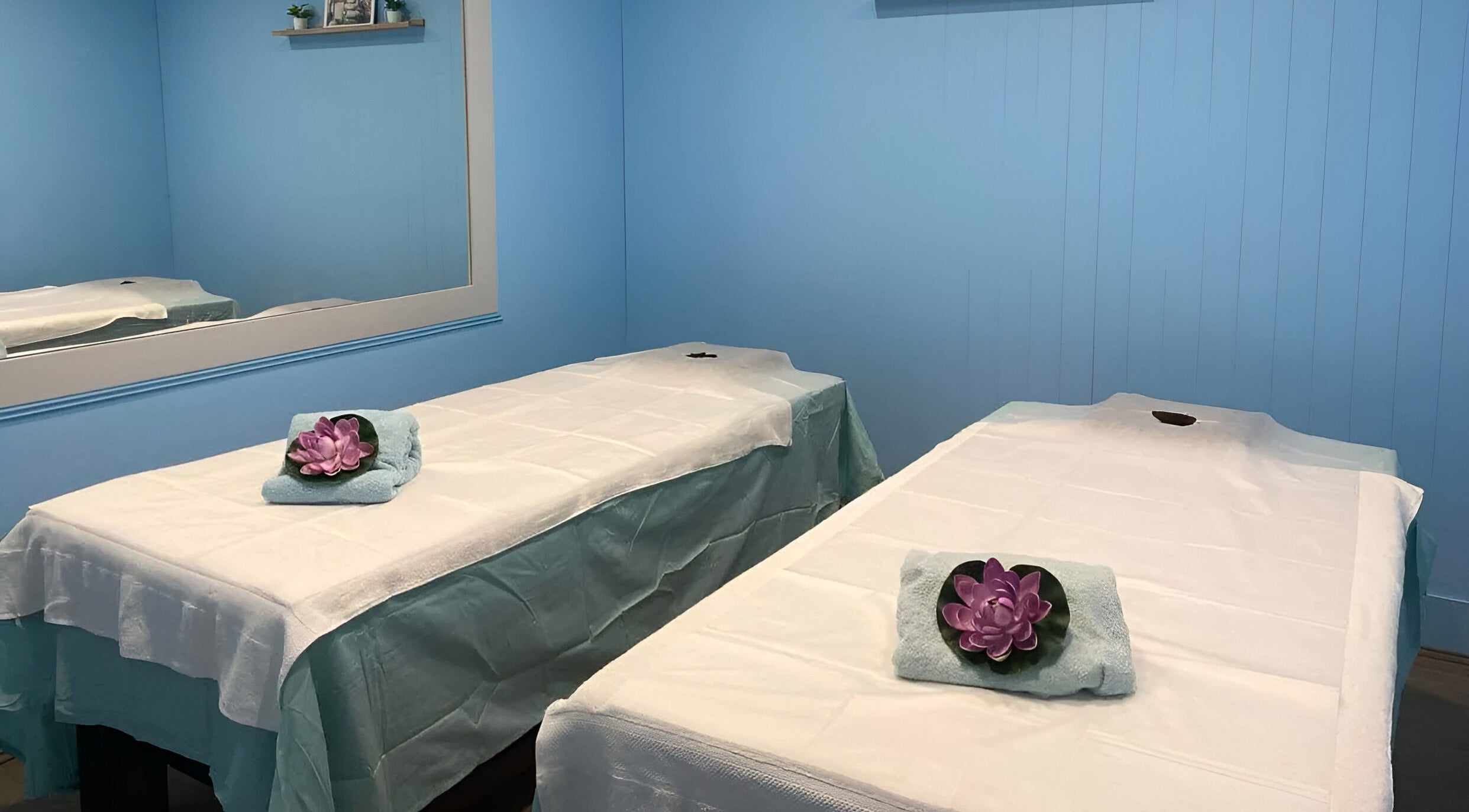 Relaxing massage room at Thai Unique Massage at Dickson, Australian Capital Territory, AU with two tables.