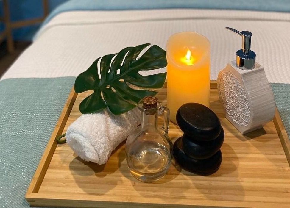 Relaxing setup at Thai Unique Massage at Dickson, Australian Capital Territory, AU with candle and massage oils.