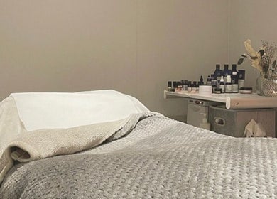 Relaxing treatment room at Blissful Beauty and Massage Therapy, Glastonbury, England, GB, with massage table.