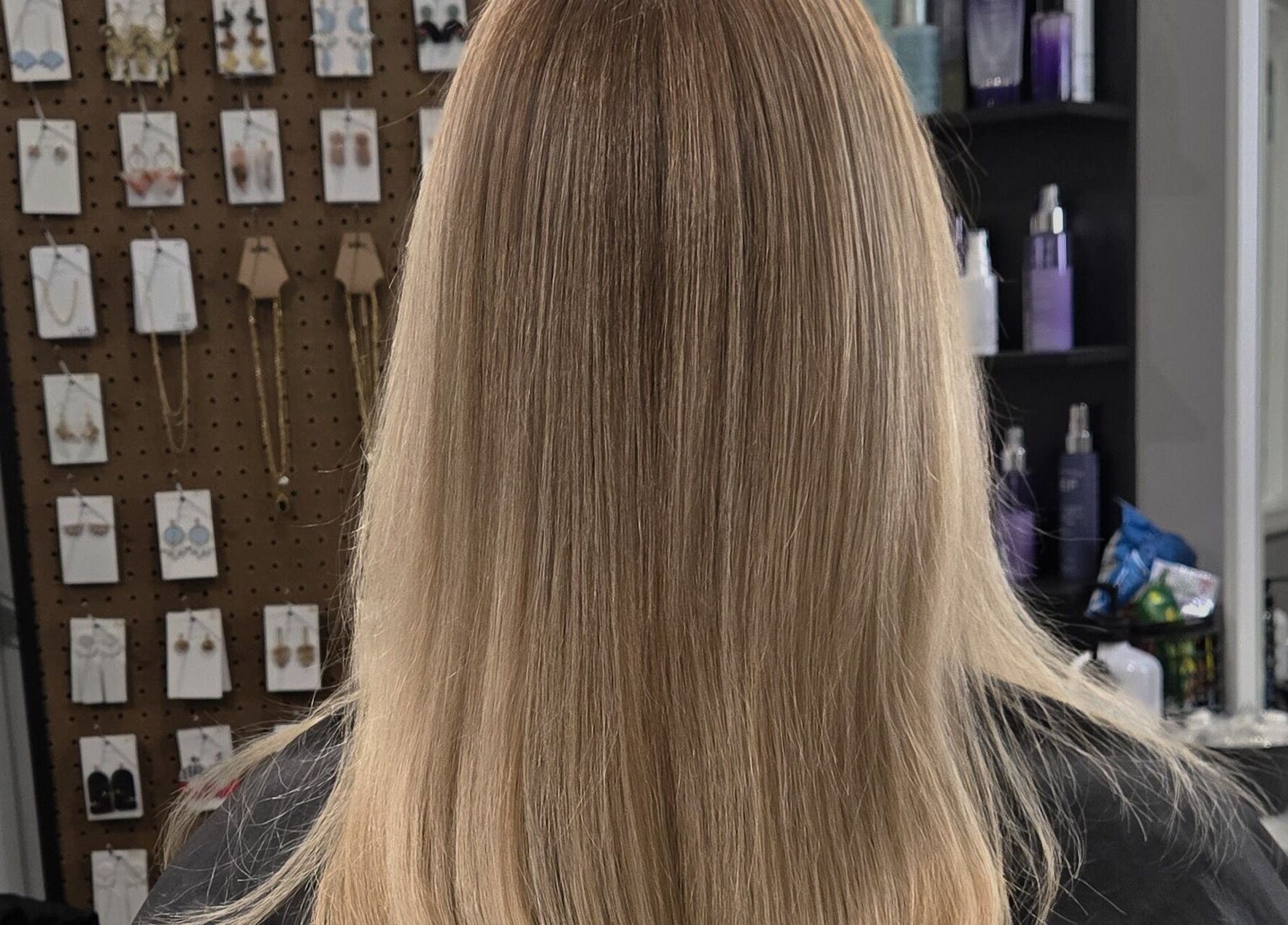 Smooth, sleek hairstyle at Studio Noir (Maddi) in Appleton, Wisconsin, US, showcasing expert hair care.
