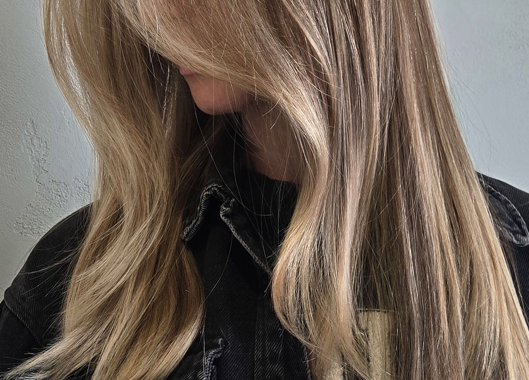 Model with flowing blonde hair at Studio Noir (Maddi), Appleton, Wisconsin, US.