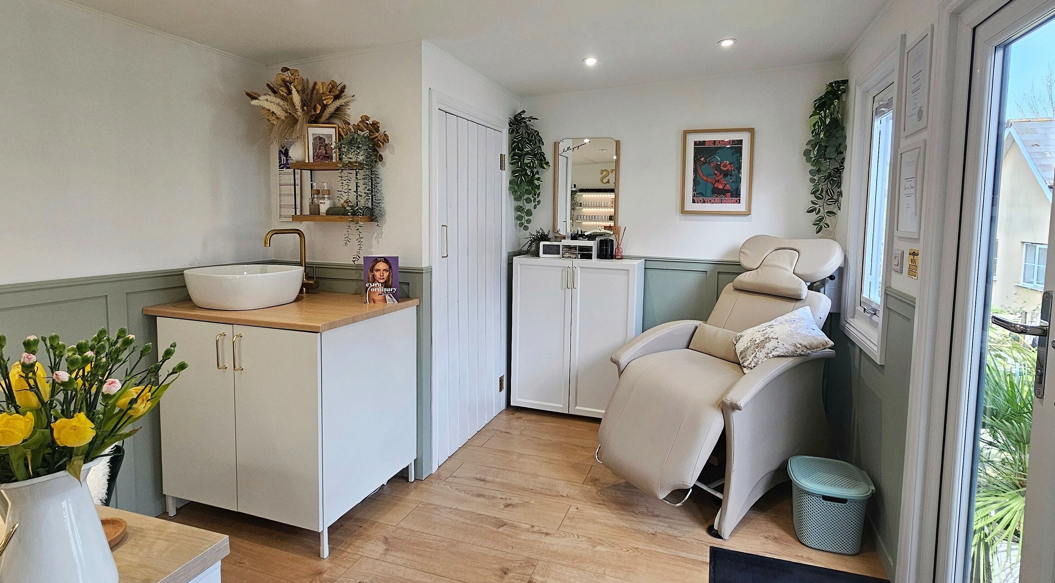 Serene beauty room at By the Shaw, Beer, England, GB featuring a plush reclining chair and elegant decor.