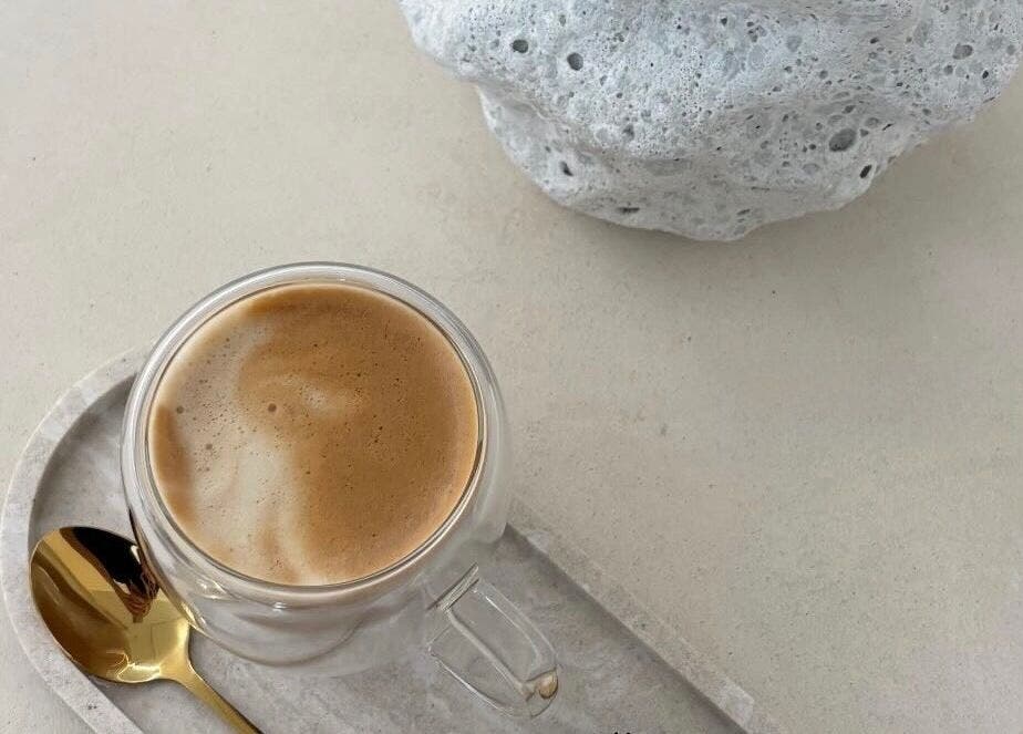 A calming cup of espresso at Emily Jane PMU & Brows, Truro, England, GB, highlighting relaxation in a minimalist style.