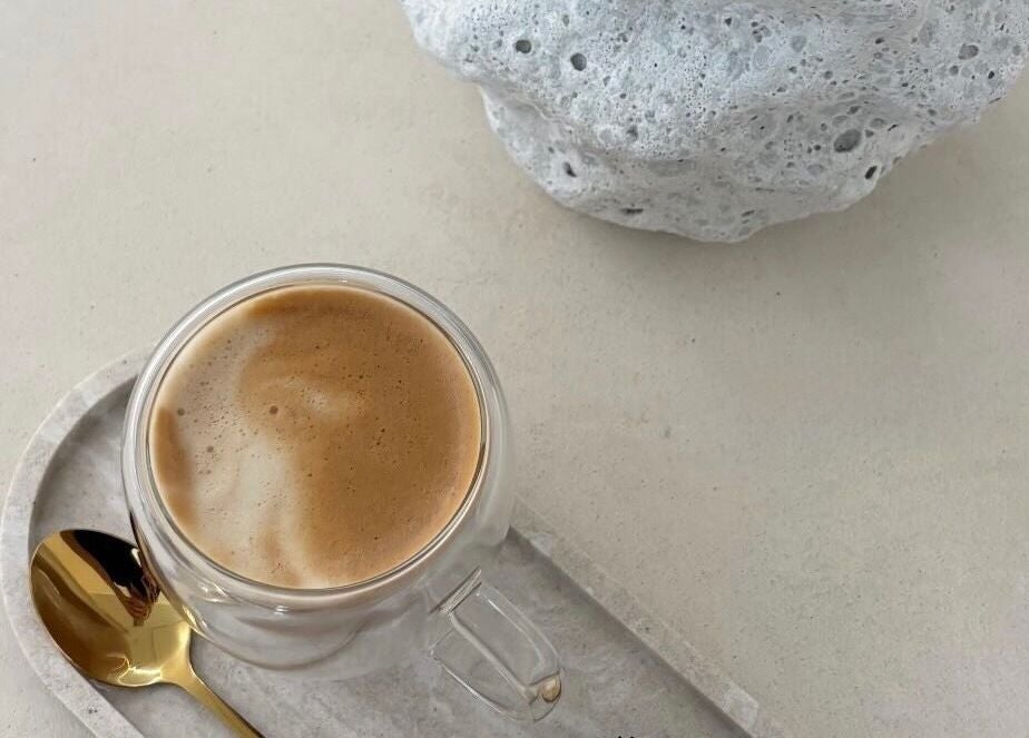 A calming cup of espresso at Emily Jane PMU & Brows, Truro, England, GB, highlighting relaxation in a minimalist style.