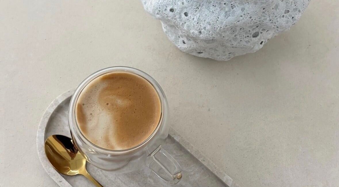 A calming cup of espresso at Emily Jane PMU & Brows, Truro, England, GB, highlighting relaxation in a minimalist style.