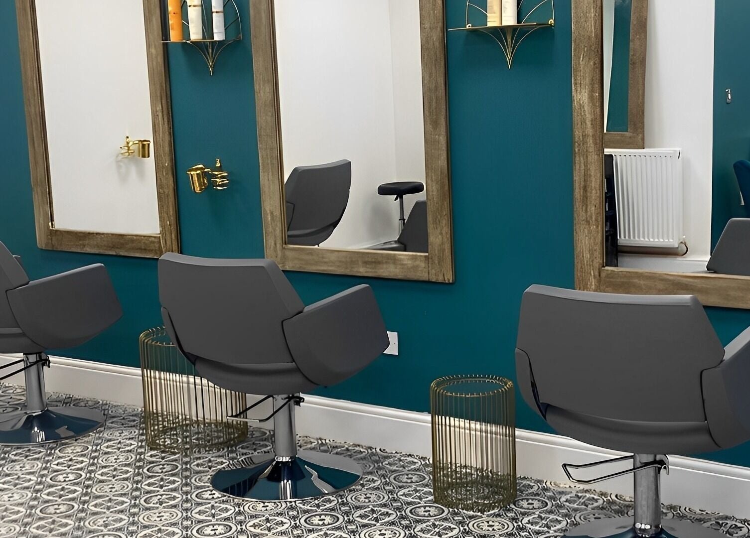 Modern salon chairs and mirrors at Graceful, Glossop, England, GB, offering a chic and relaxing ambiance.