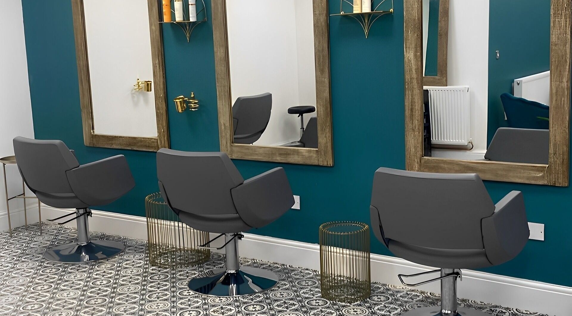 Modern salon chairs and mirrors at Graceful, Glossop, England, GB, offering a chic and relaxing ambiance.