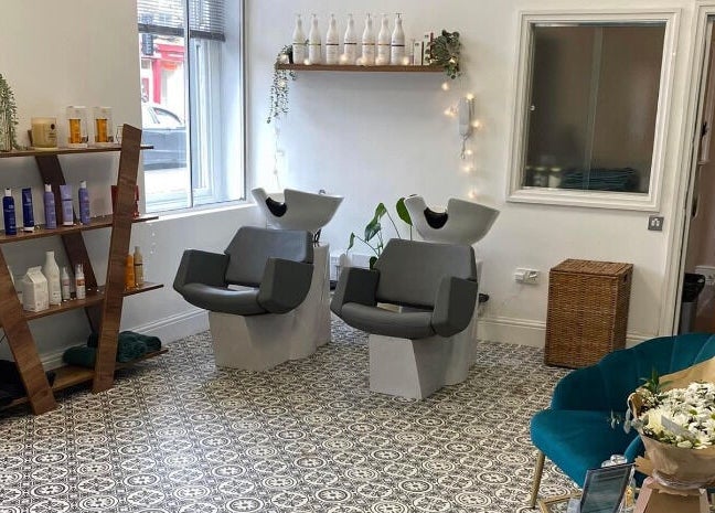Stylish salon interior at Graceful, Glossop, England, GB, with chic wash stations and elegant decor.