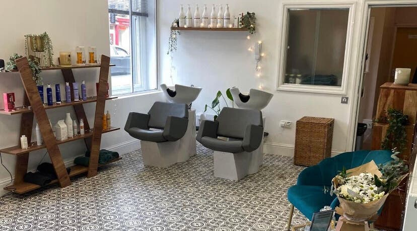 Stylish salon interior at Graceful, Glossop, England, GB, with chic wash stations and elegant decor.