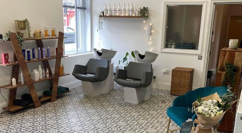 Stylish salon interior at Graceful, Glossop, England, GB, with chic wash stations and elegant decor.