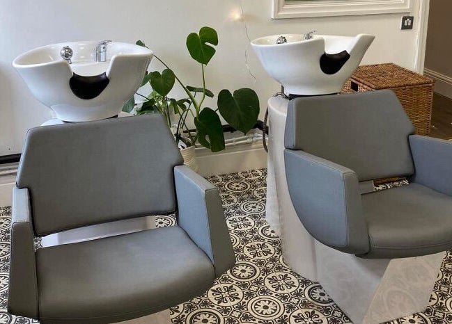 Modern hair wash chairs at Graceful, a beauty venue in Glossop, England, GB.