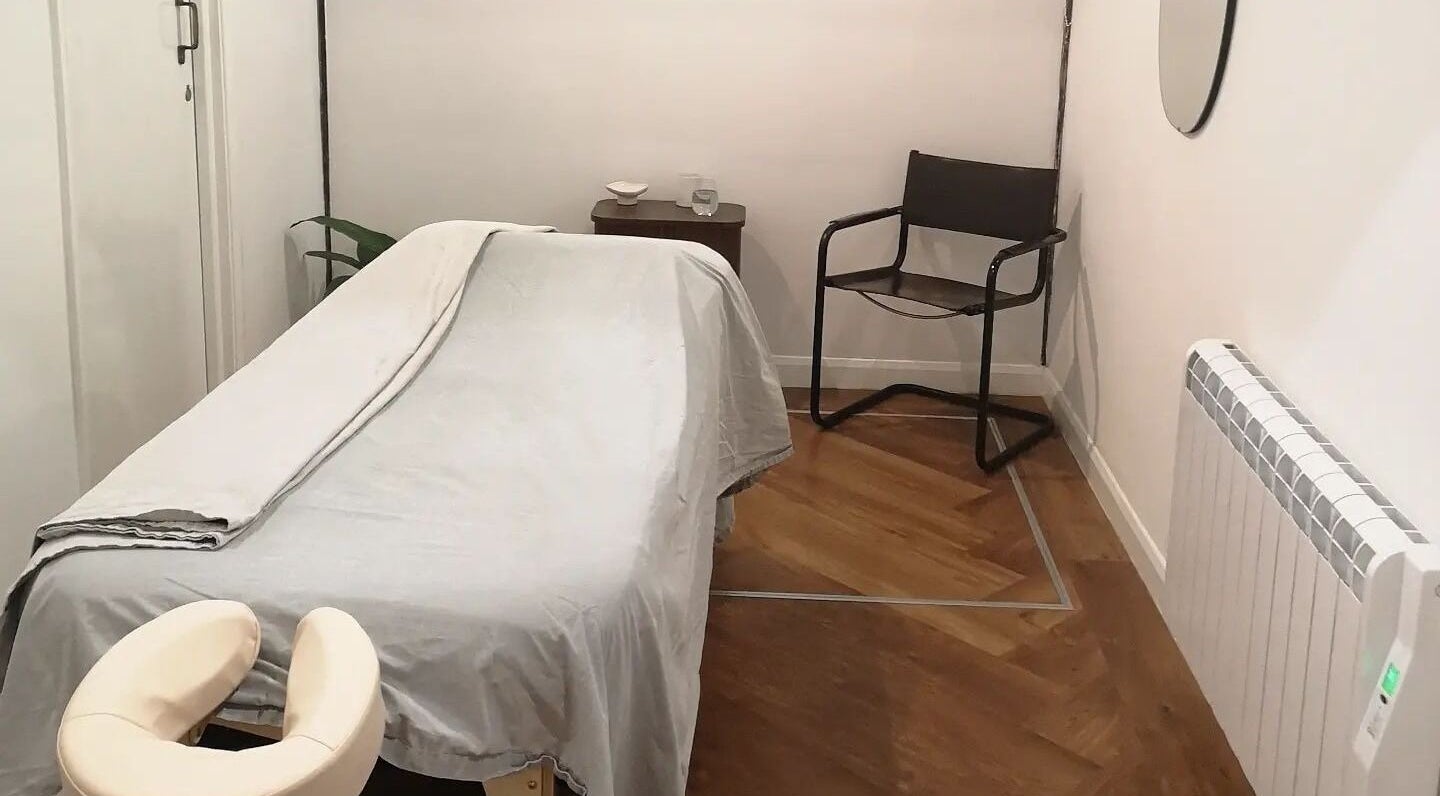 Serene massage room at Amelia Balding Massage at Pivotal House, Norwich, England, GB with a comfortable table.