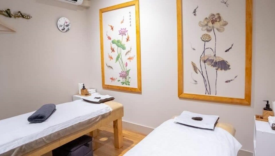 Peaceful massage room at Gratitude Massage, Toorak Gardens, South Australia, AU with calming decor and two tables.