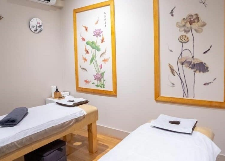 Peaceful massage room at Gratitude Massage, Toorak Gardens, South Australia, AU with calming decor and two tables.