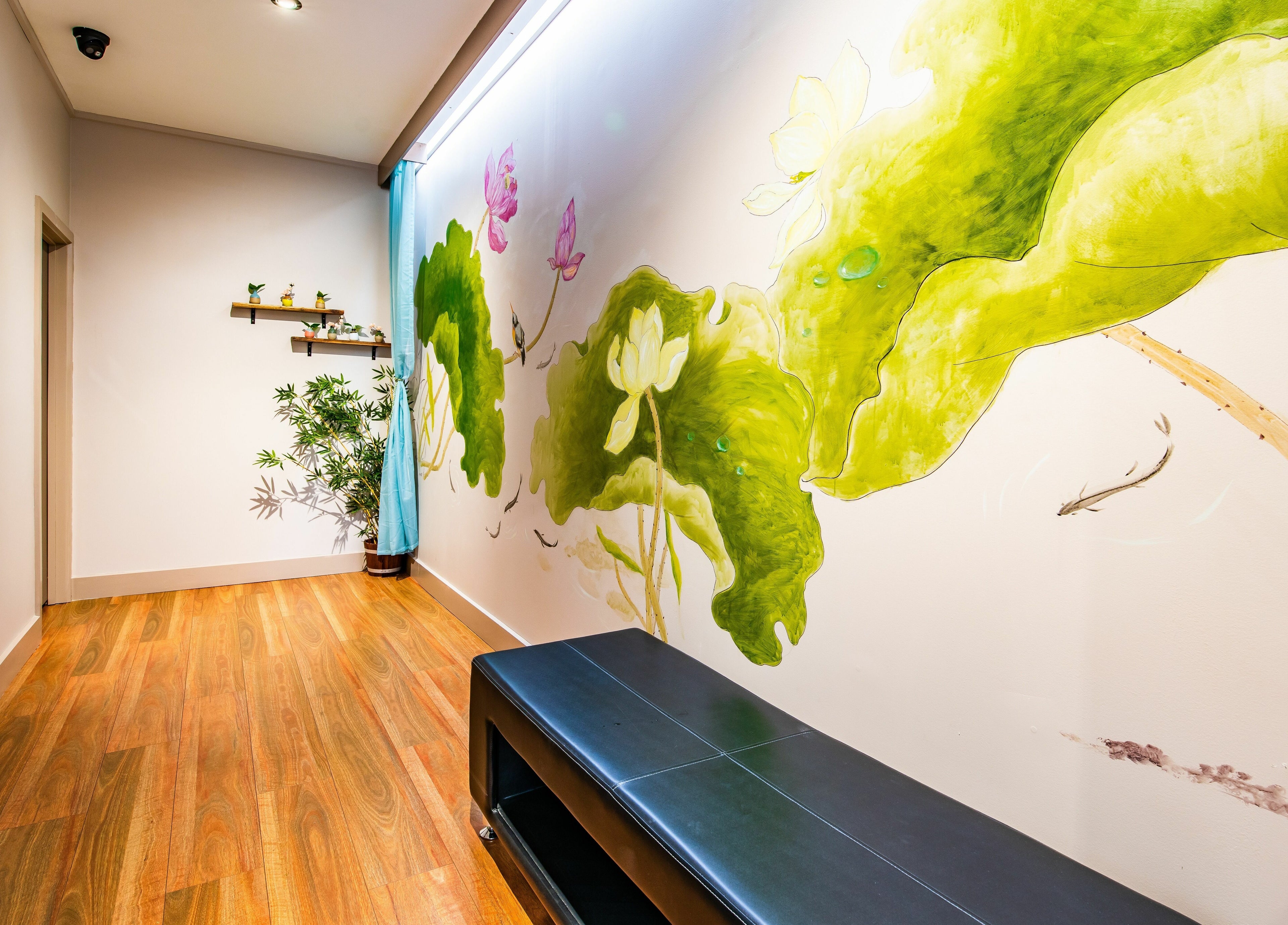 Serene hallway with botanical mural at Gratitude Massage, Toorak Gardens, South Australia, AU.