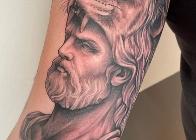 Intricate lion warrior tattoo from Kracken Body Art in Gorleston-on-Sea, England, GB.