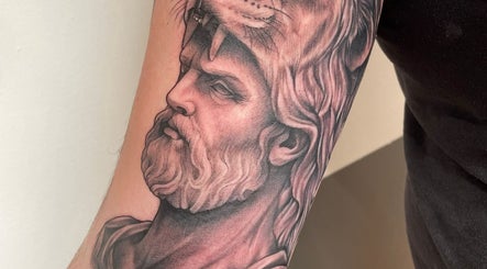 Intricate lion warrior tattoo from Kracken Body Art in Gorleston-on-Sea, England, GB.