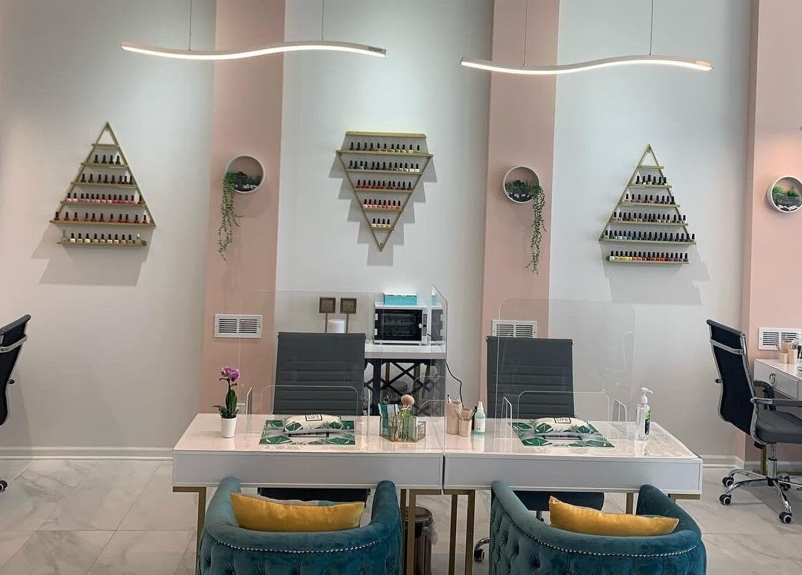 Elegant nail salon at Bellaviva LLC in Aurora, Illinois, US featuring modern design and plush seating.