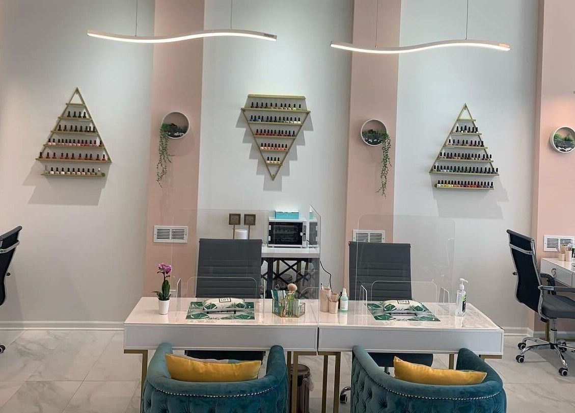Elegant nail salon at Bellaviva LLC in Aurora, Illinois, US featuring modern design and plush seating.