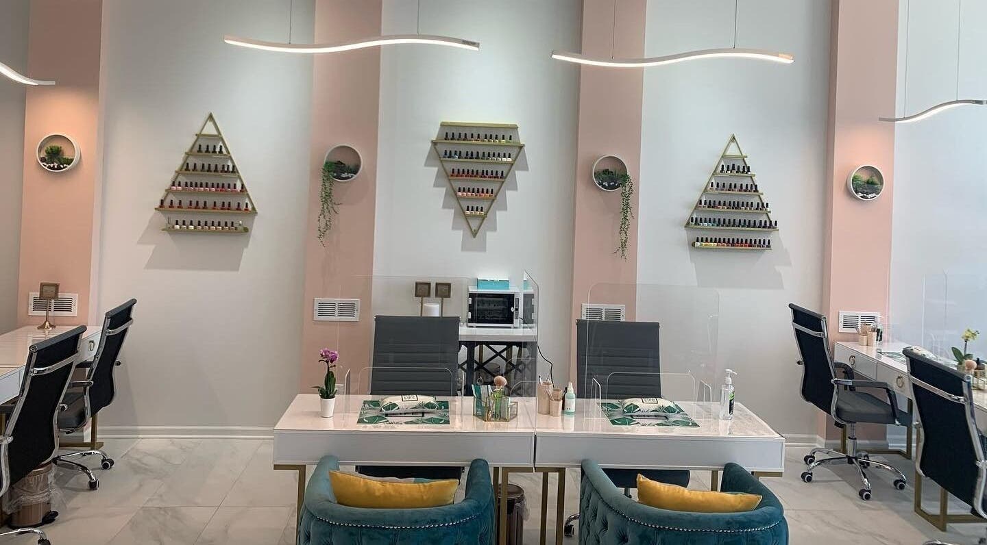 Elegant nail salon at Bellaviva LLC in Aurora, Illinois, US featuring modern design and plush seating.