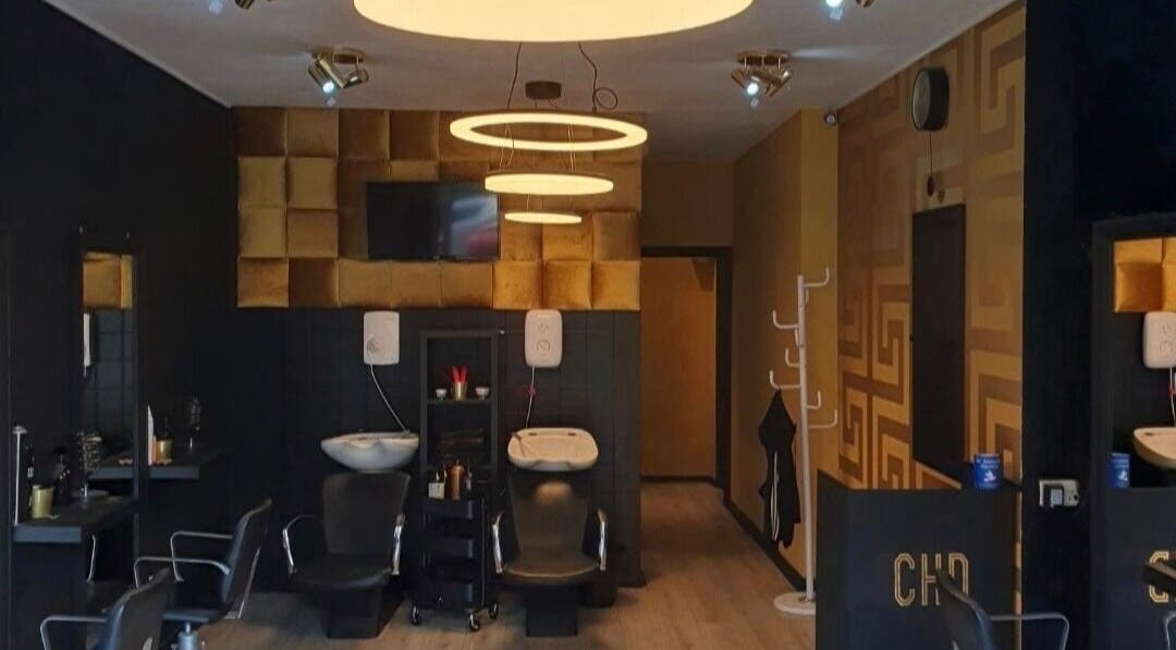 CHD beauty salon interior in Glasgow, Scotland, GB, featuring modern black and gold decor.