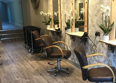 Stylish interior of Carly and Co Hairdressing salon, Morecambe, England, GB with elegant salon chairs and mirrors.