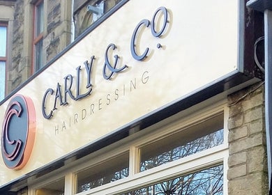 Carly and Co Hairdressing storefront in Morecambe, England, GB with elegant signage.