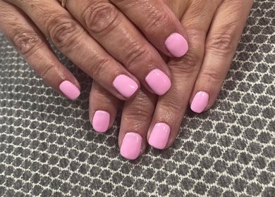 Pink manicured nails from Cuts ‘N’ Clippers Refinery Rooms, Horley, England, GB showcasing nail treatments.