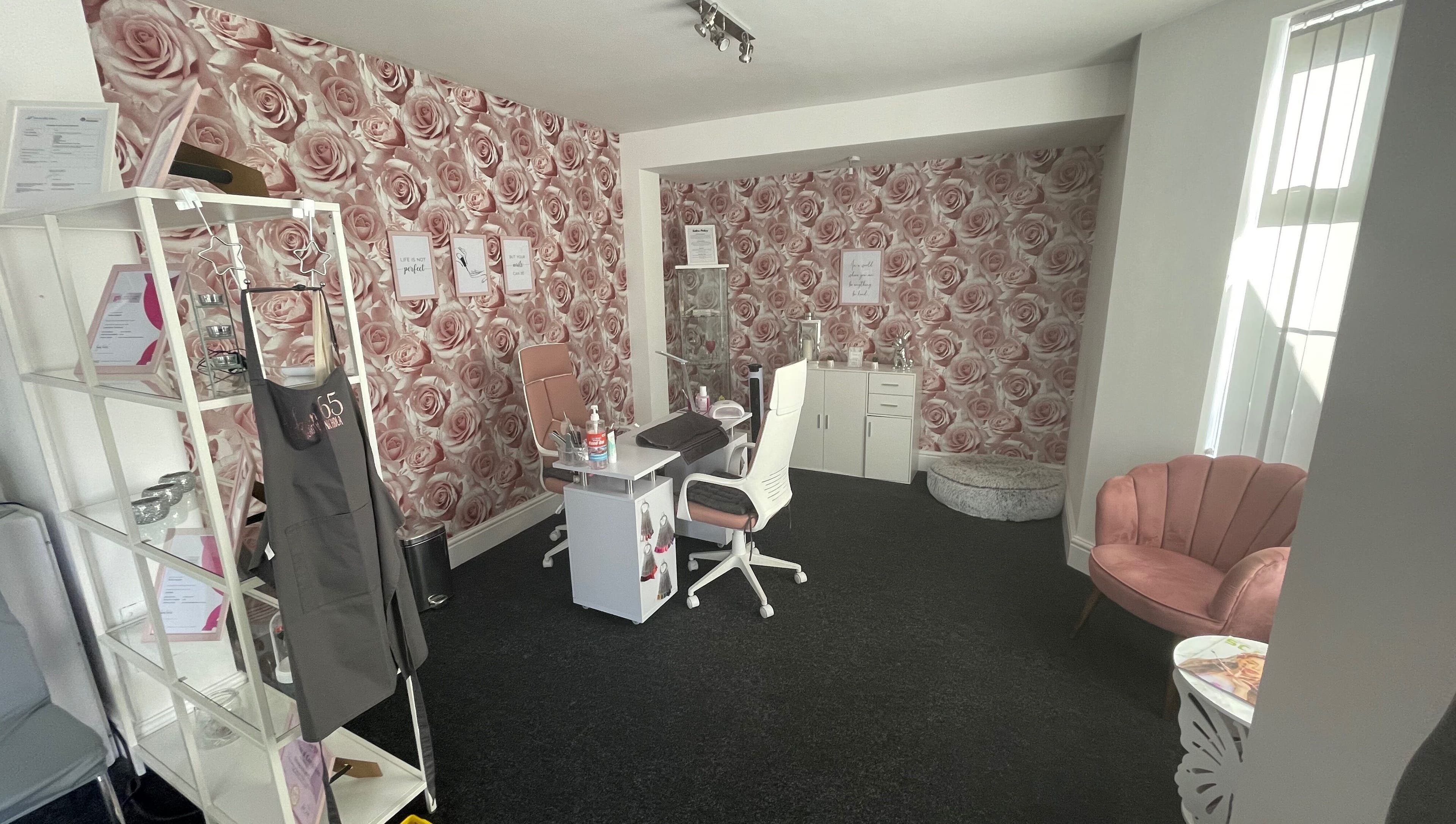 Chic interior of Salon 65 Lytham with rose wallpaper, in Lytham Saint Annes, England, GB.