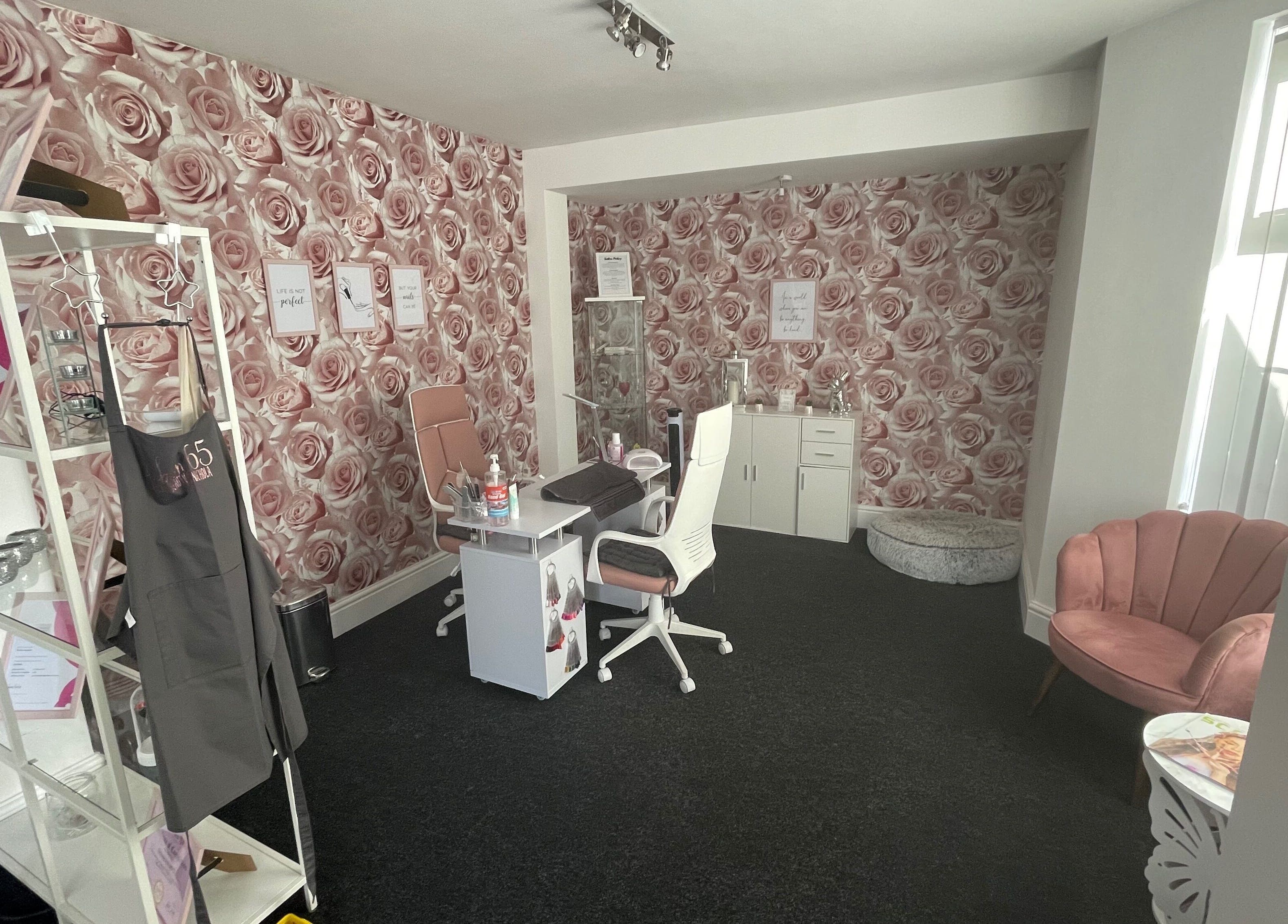 Chic interior of Salon 65 Lytham with rose wallpaper, in Lytham Saint Annes, England, GB.