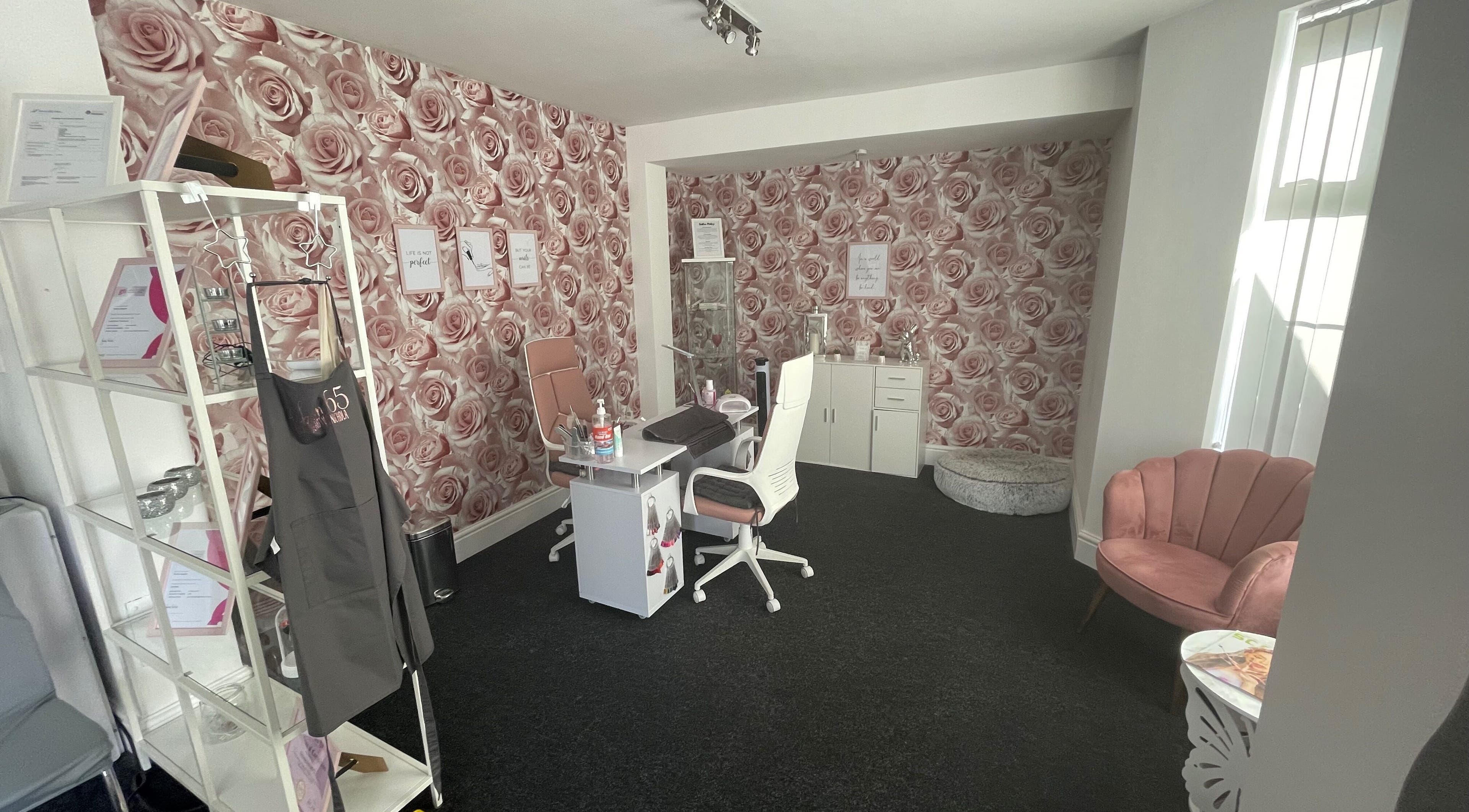 Chic interior of Salon 65 Lytham with rose wallpaper, in Lytham Saint Annes, England, GB.