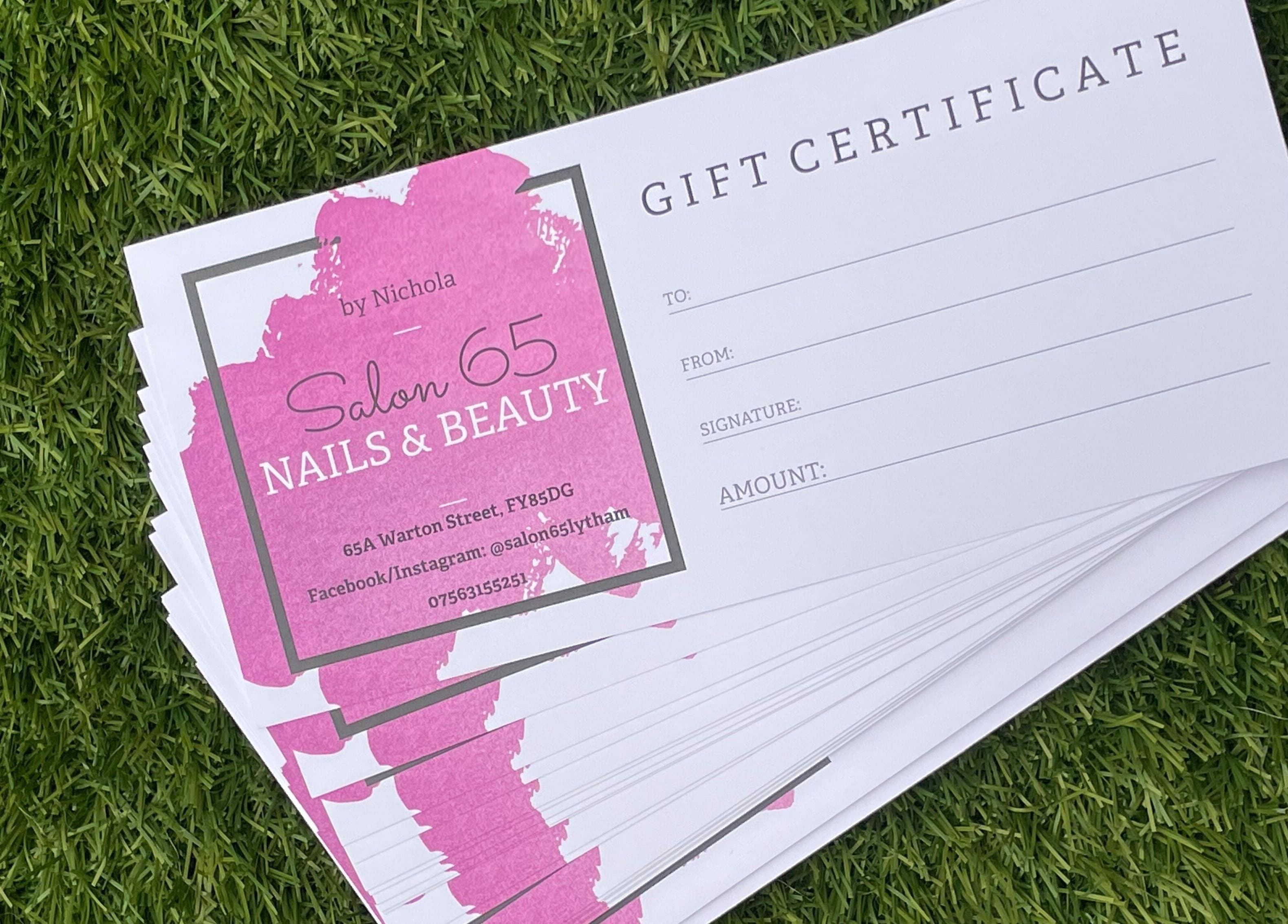 Gift certificate stack from Salon 65 Lytham on grass, Lytham Saint Annes, England, GB.