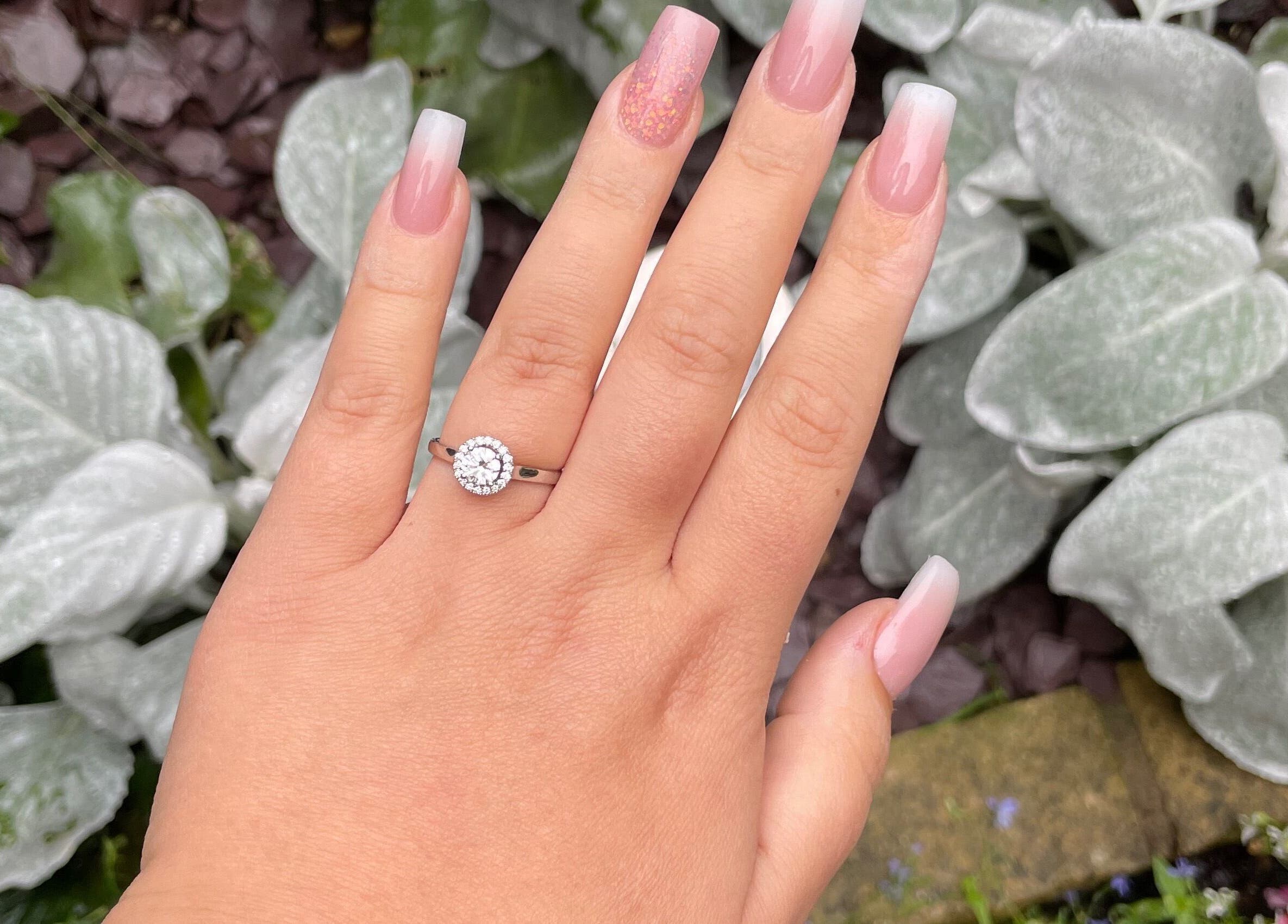 Sophisticated nail art at Salon 65 Lytham in Lytham Saint Annes, England, GB, featuring pastel shades and a diamond ring.