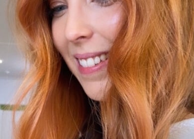 Woman with vibrant hair glowing at Luxe Hair Lab, Kyneton, Victoria, AU. Perfect hair day captured.