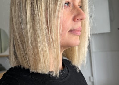 Woman with stylish blonde bob haircut at Luxe Hair Lab, Kyneton, Victoria, AU.